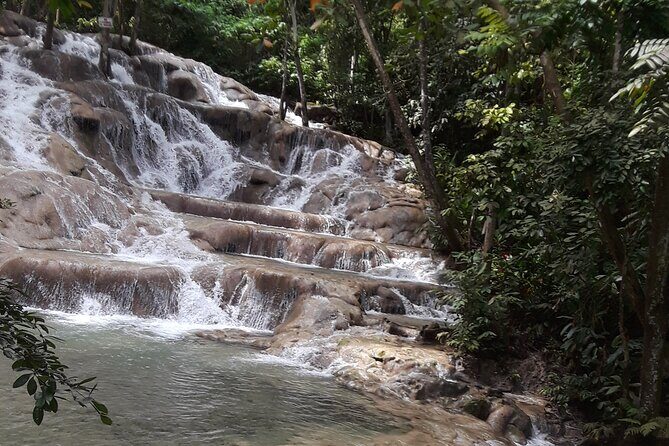 Private Tour to Dunn's River Falls From Ocho Rios - At the park: wrist band, beach start, and your first taste of the falls